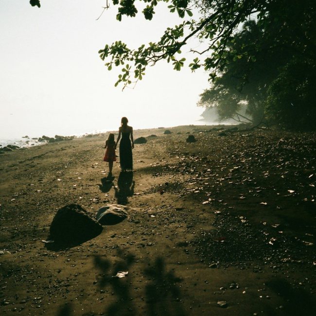 woman and girl on field